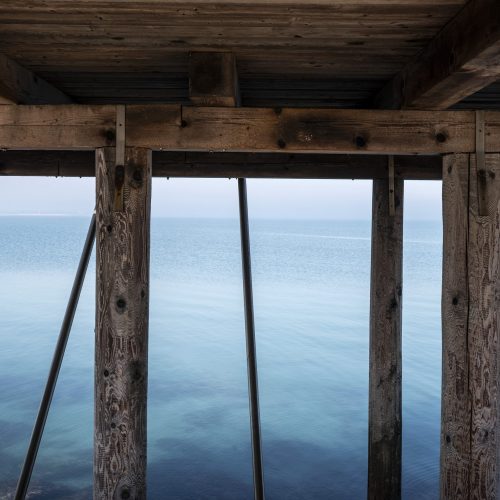 Sea below a fishing structure