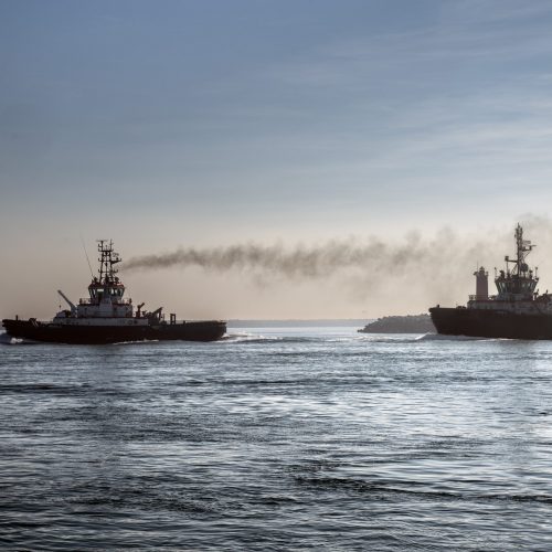 Towboats sailing along the canal for large ships